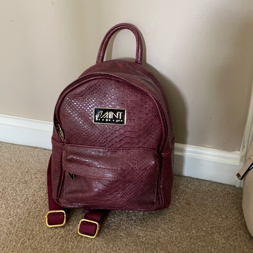 Mint worldwide small anaconda backpack